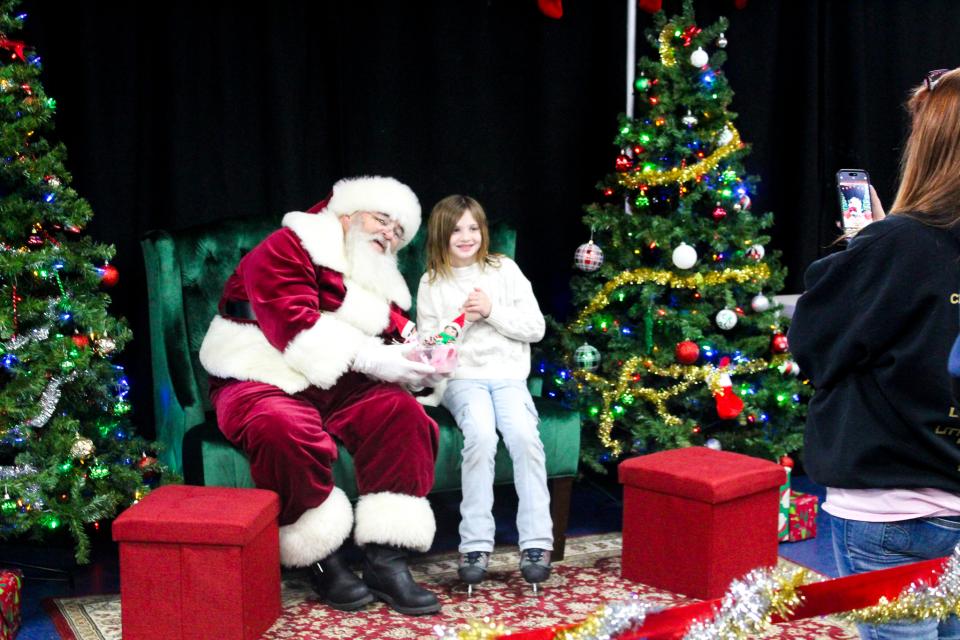 Skater brings her elves to Santa so they can give a report before Christmas Eve.
