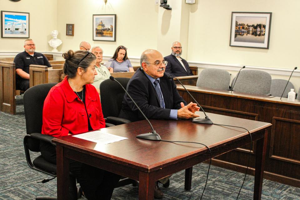 Megan Greenwood, left, and Dr. Fahmi, right,. discuss the Health Department&#039;s recent collaboration with Global Vision and local ophthalmologists and optometrists.