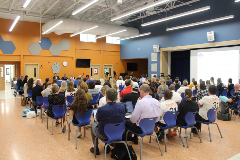 Public gathers to provide commentary on the FY 2025 Budget at the Easton Elementary School.