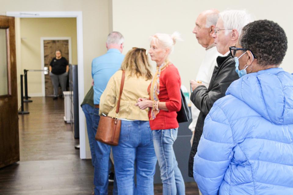 Visitors sign up for the tour. The Election Board requires knowing every person that enters or leaves the secure voting equipment room.
