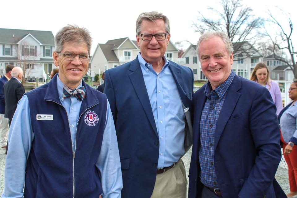 Council Vice President Pete Lesher stands with County Manager Clay Stamp and U.S. Senator Van Hollen.