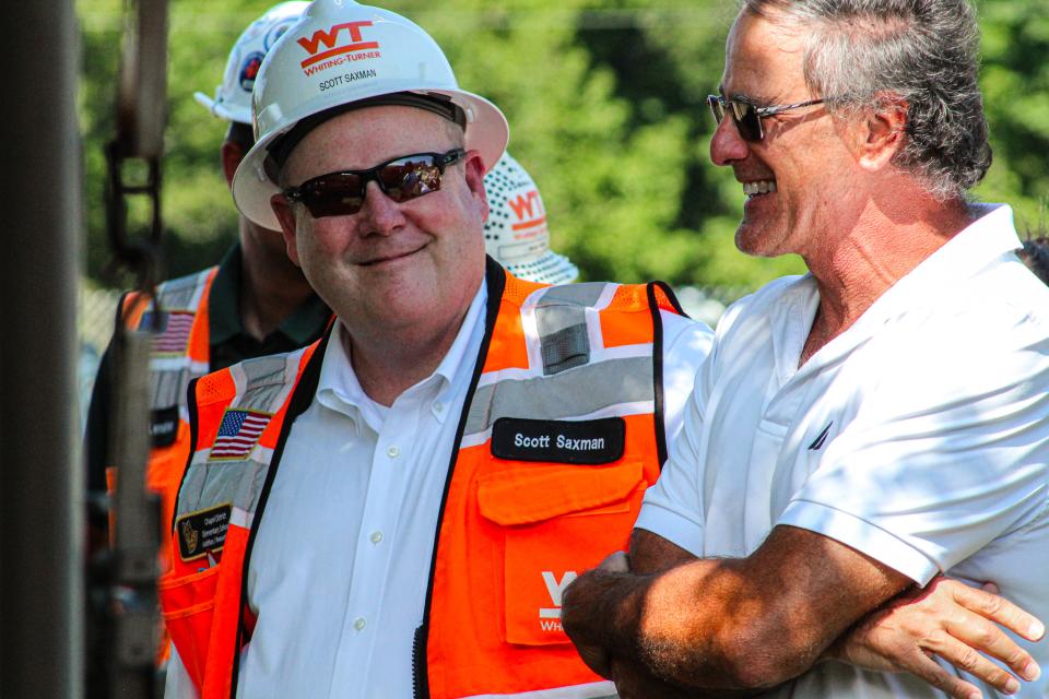 Ray Clarke, County Engineer, stands with Whiting-Turner construction team.