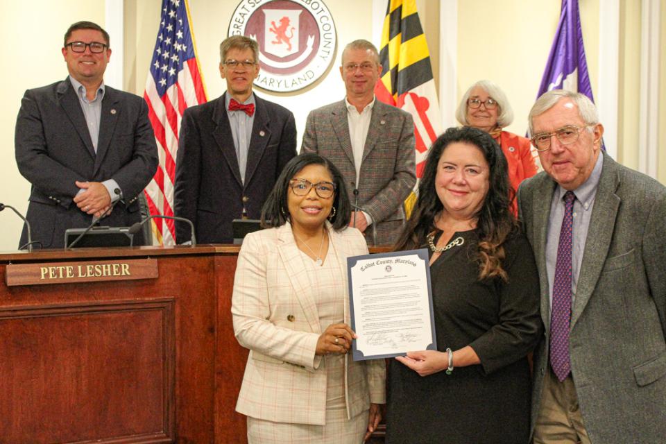 Canssandra VanHooser, Director of Economic Development and Tourism, accepts a proclamation Economic Development Week.