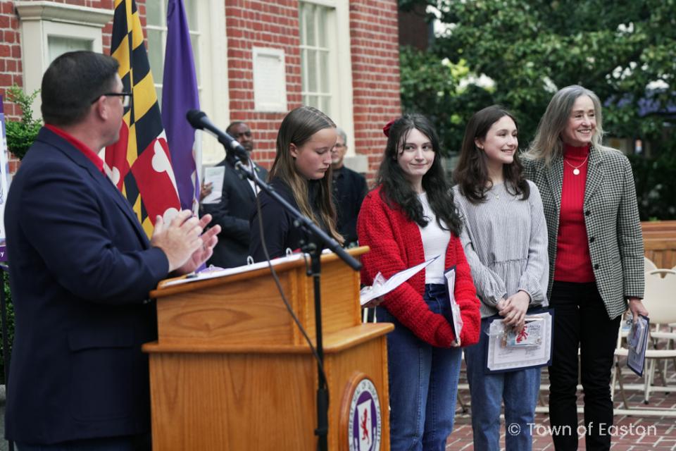 Paige Smith, Makayla Moore, Josephine Shaw, and Lisa Ghezzi are honored for their poster artwork during the 2024 Talbot Day Ceremony.