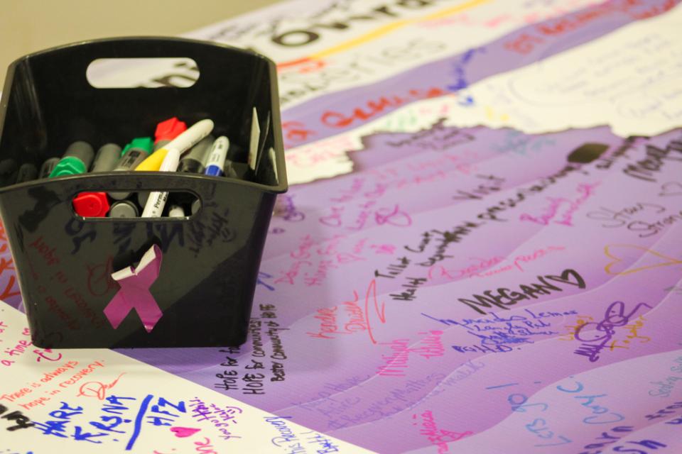 Participants signed the Town Hall Series poster with their commentary and memorials.