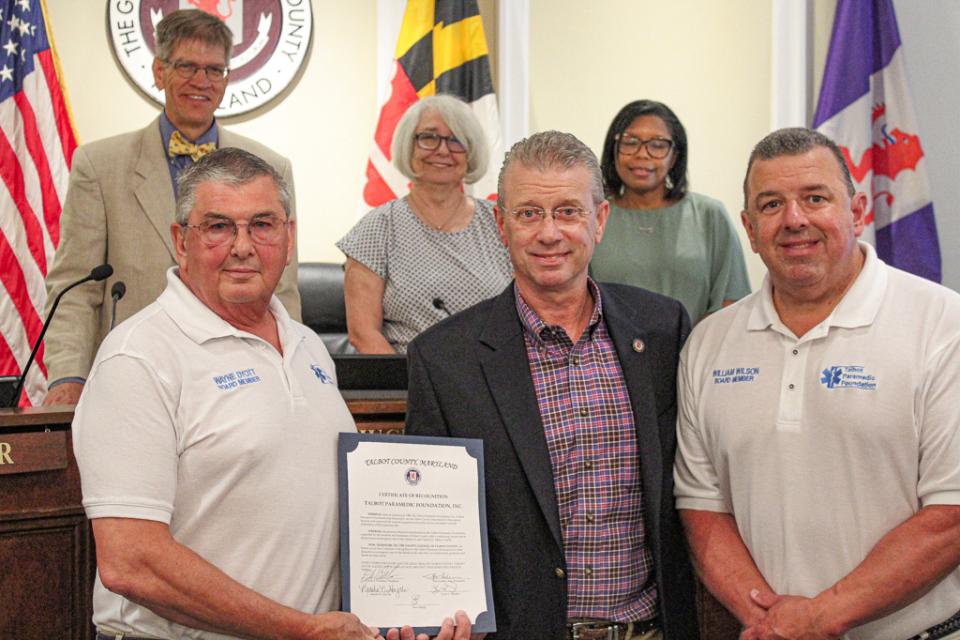 Council President Chuck Callahan presents Wayne Dyott and William Wilson of the Talbot Paramedic Foundation with a Certificate of Recognition.