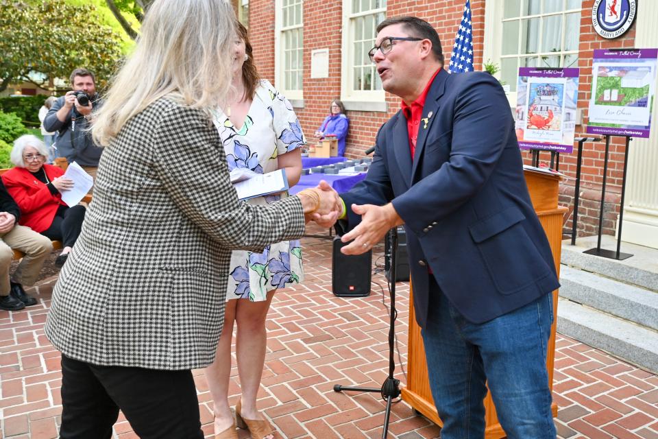 Council Member Dave Stepp shakes hands with Citizen and Service Award Nominnee.