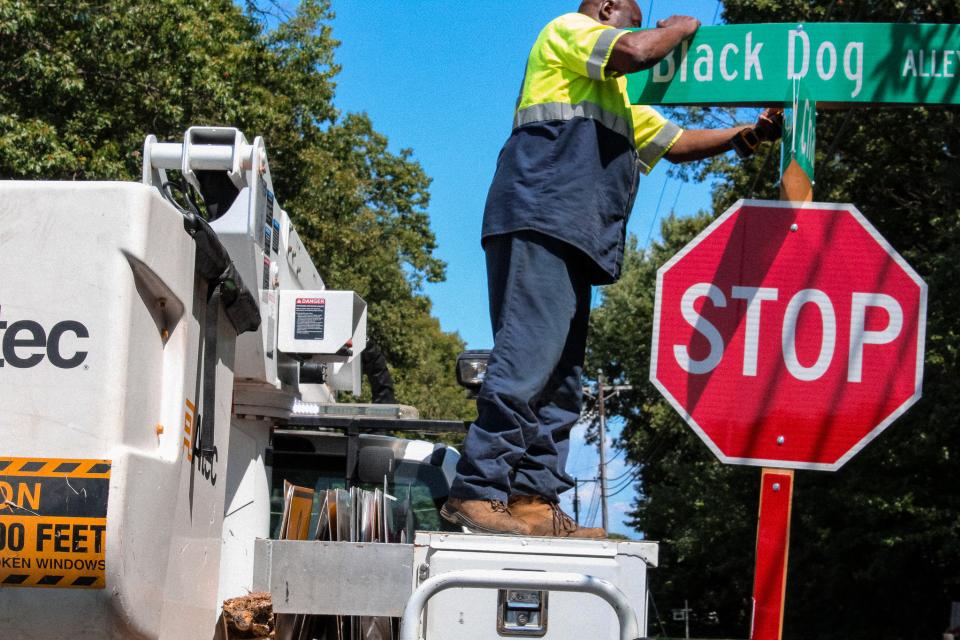 Mike Potter, Sign Technician at Talbot County Roads Department, replaces a recently vandalized road sign.