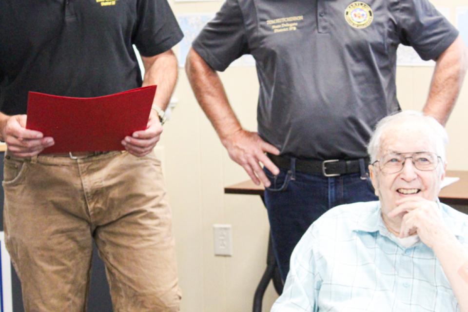 Maryland District 37 Senator Johnny Mautz (left) and Delegate Tom Hutchinson presents the Senate Resolutions to Joe Secrist (bottom right).