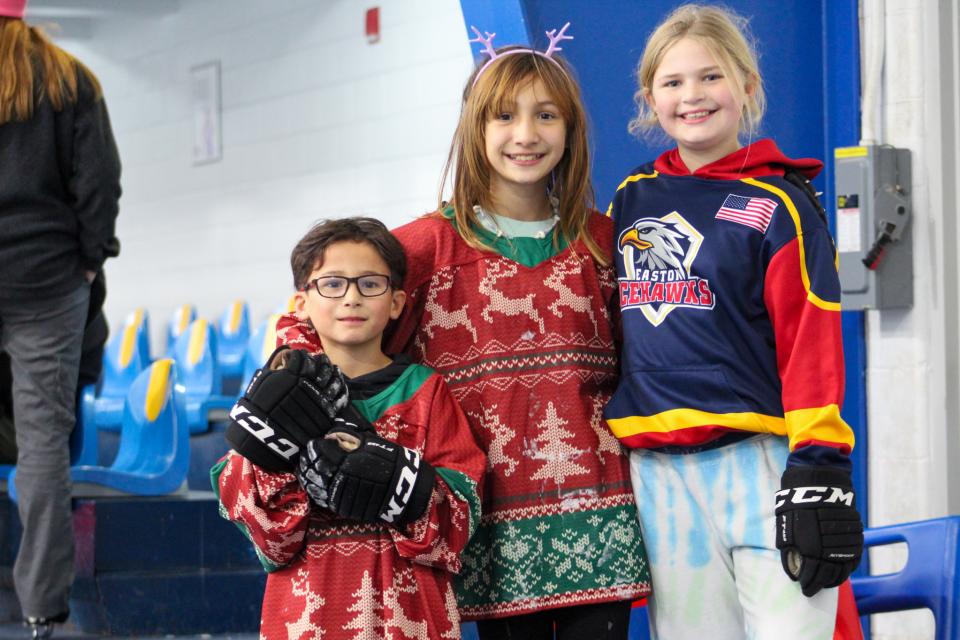 From left: Emory Masten, Aree Masten, Lucy Thomas wait off the ice.